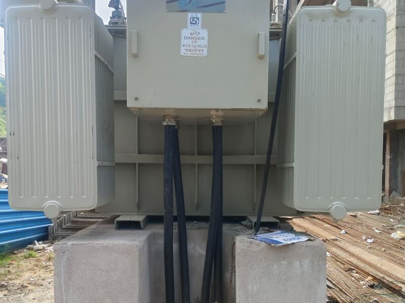 Cables routed from the transformer into the trench