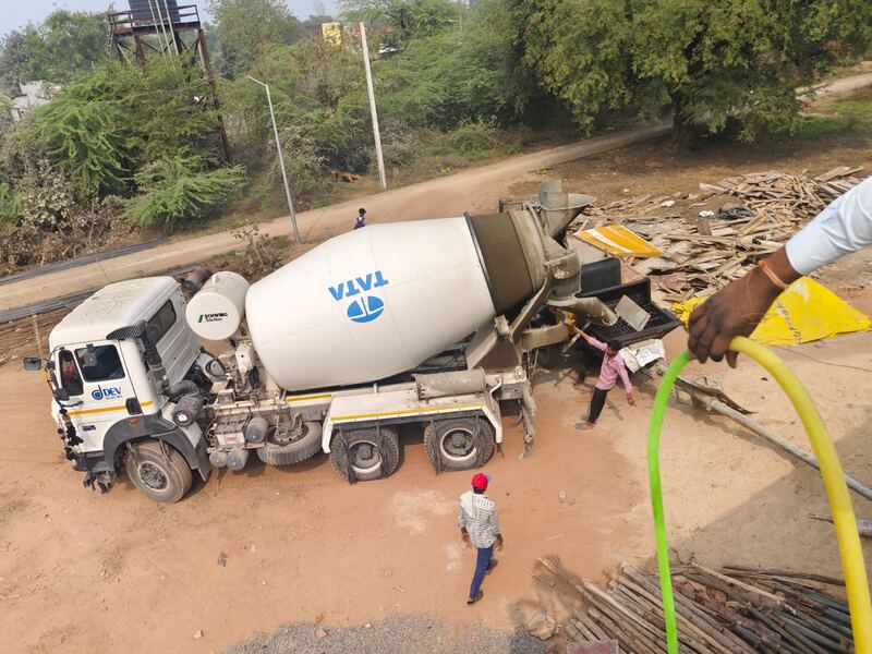 Transit mixer discharging concrete at the pour point