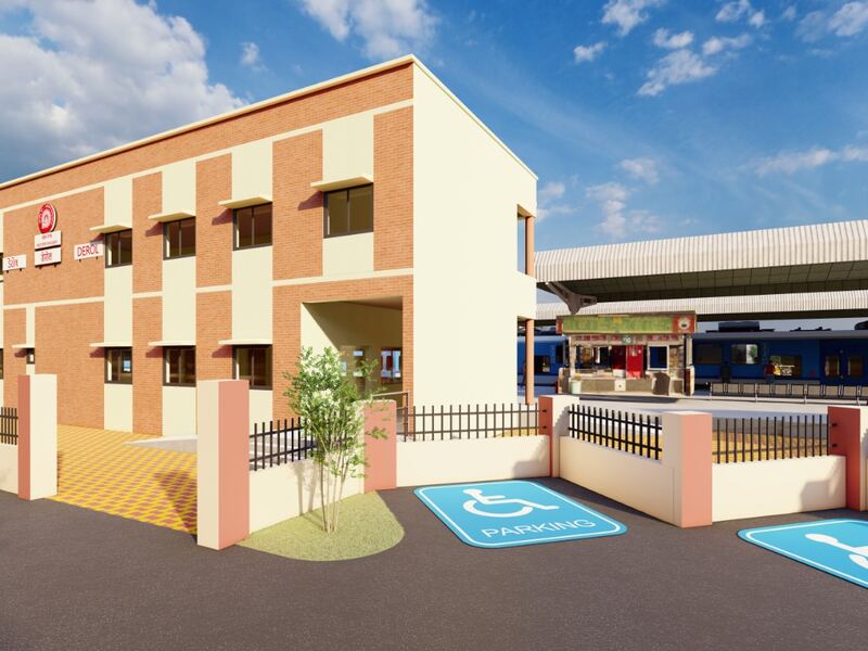 The finished station building with its platform and covered walkway